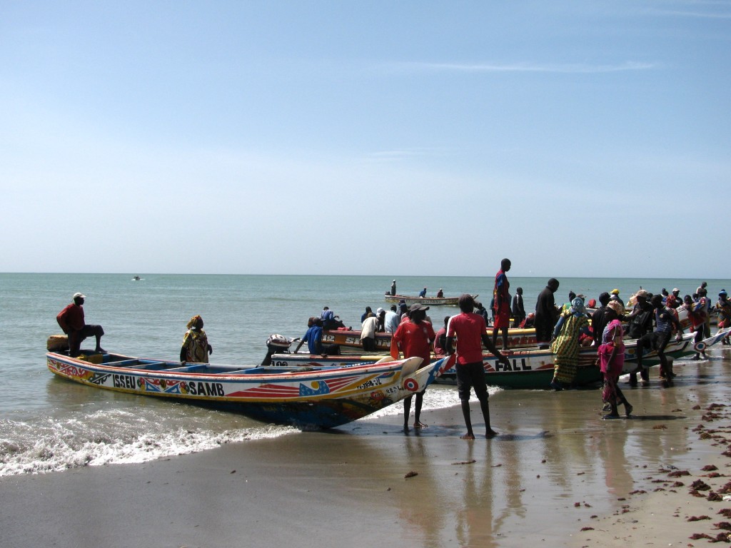 Fisherfolk prepare to head out on their boats for the day
